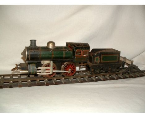 A BING Gauge 1 Tinplate Train Set comprising a C/W Windcutter 0-4-0 Locomotive and Tender and 2 x 4 wheel Coaches - the Locom