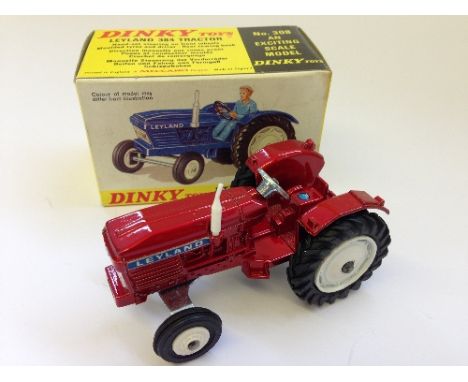 Dinky Toys 308 Leyland 384 Tractor, metallic red with white hubs. VG (minor retouching to rear hubs, driver missing) in VG bo