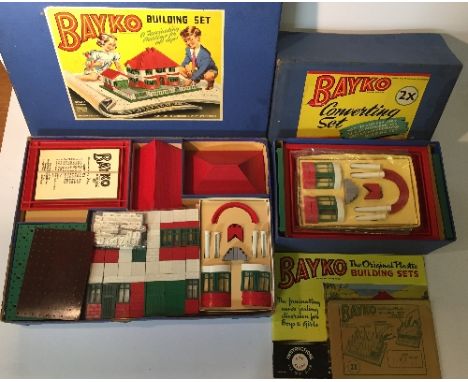 Bayko Set No.2, containing various red, green, white and grey parts, including: 2 x chimney; 2 x curved green window; 4 x pil