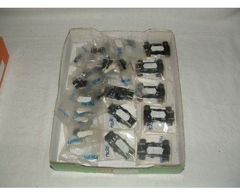 A tray containing new SCALEXTRIC spares - 5 x Motors for Micro Cars with chassis guide, wheels, pick up and braids - 3 x Moto
