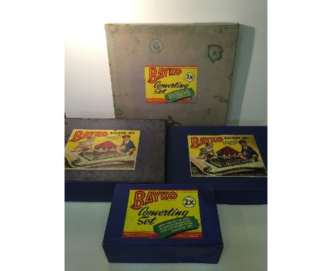 Four Bayko construction sets: No.2, includes instruction booklet (in reproduction box); No.2X, parts include large roof and 5