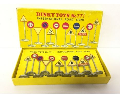 Dinky Toys 771 International Road Signs, comprising of twelve signs including Dangerous Bend and Level Crossing Gates. Some l