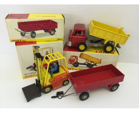 Three Dinky Toys Commercial models: 438 Ford D800 Tipper Truck, red cab with yellow tipper and hubs; 428 Trailer, red with bu