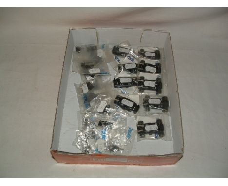 A tray containing new SCALEXTRIC spares - 5 x Motors for Micro Cars with chassis guide, wheels, pick up and braids - 4 x Moto