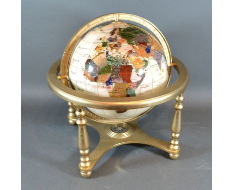 A Stone Set Globe with Brass Stand, 28 cms tall 