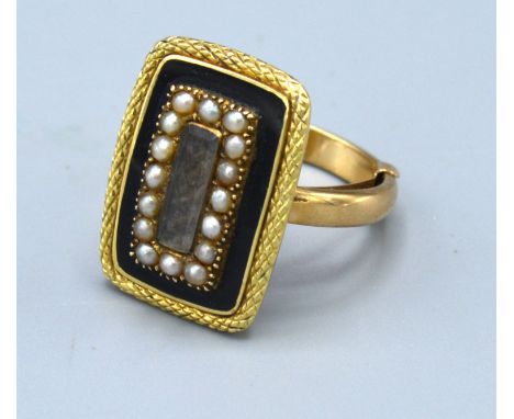 A 9ct. Gold Mourning Ring set seed pearls and enamel, ring size N, 7.2 gms. 