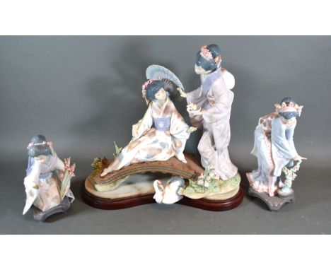 A Large Lladro Porcelain Group Figures on a Bridge 33 cms tall together with two other Lladro porcelain figures 