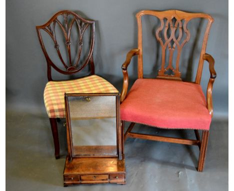 A 19th Century Mahogany Chippendale Style Armchair together with a mahogany Hepplewhite style side chair and a mahogany swing