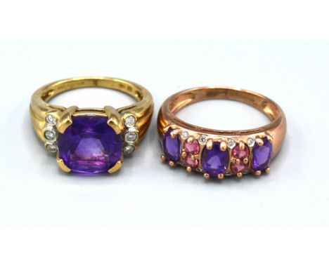 A 9ct. Gold Dress Ring with central amethyst flanked by diamonds, ring size K, 4.7 gms. together with another similar 9ct. go