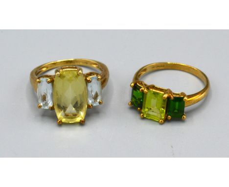 A 9ct. Gold Dress Ring set three green stones, ring size N, 2.5 gms. together with another similar 9ct. gold dress ring, ring