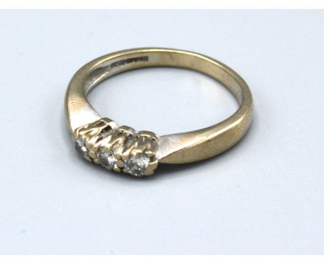 An 18ct White Gold Three Stone Diamond Ring with pierced setting, 3.2 gms Size L 