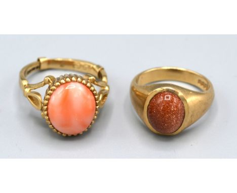 A 9ct. Gold Dress Ring set cabochon coral, ring size K, 4.5 gms. together with another similar ring set gold stone, ring size