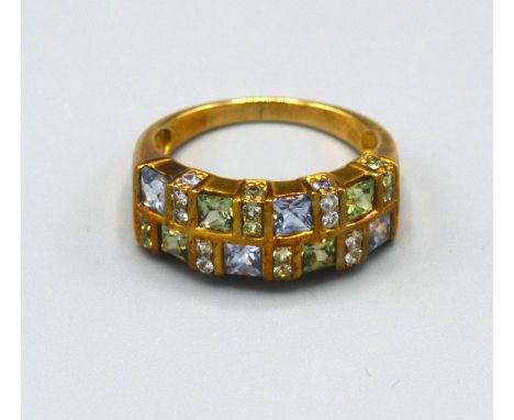 A 9ct. Gold Band Ring set peridot, aquamarine and small diamonds interspaced, ring size N, 3.8 gms. 