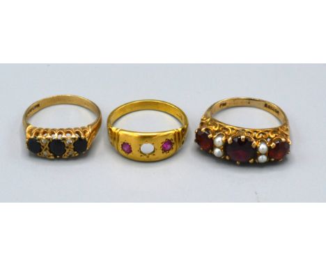 A 9ct. Gold Dress Ring set three garnets interspaced with pearls, ring size M, 3.4 gms. together with a 9ct. gold sapphire an