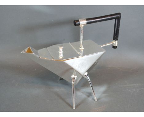 A Silver Plated Teapot in the style of Christopher Dresser with ebonised handle, 23 cms long 