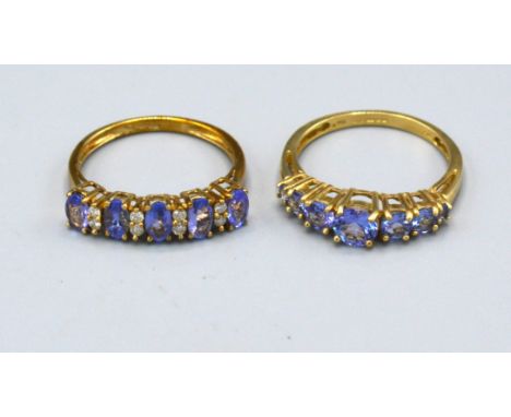 A 9ct. Gold Band Ring set five tanzanite interspaced with diamonds within a pierced setting, ring size N, 1.8 gms. together w