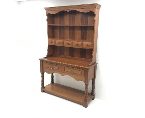 20th century mahogany dresser, raised two tier plate rack with five trinket and two drawers, turned supports joined by solid 