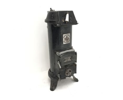 Early 20th century French black enamel cast iron stove, three hinged doors to the front, W35cm, H79cm, D40cm - Condition Repo
