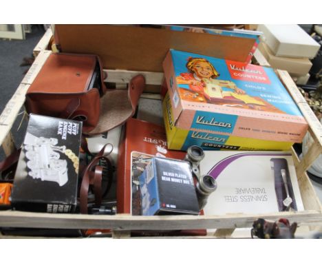 A crate of sundries, camera, child's sewing machine, field specs etc 