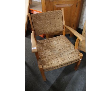 A light beech and sea grass armchair.  CONDITION REPORT: Some movement in the joints of the arms, otherwise good condition. 