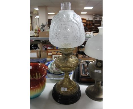A Victorian brass and glass oil lamp 