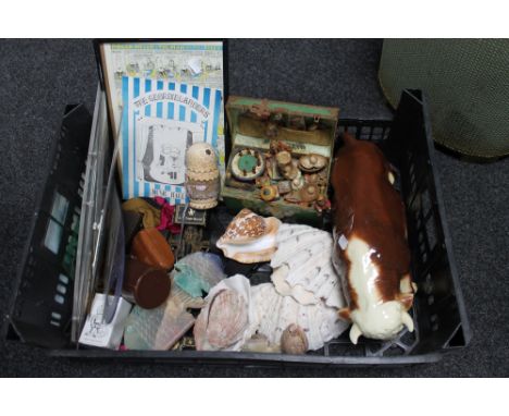 A crate of ceramic Bull figure, shells and ornaments etc 