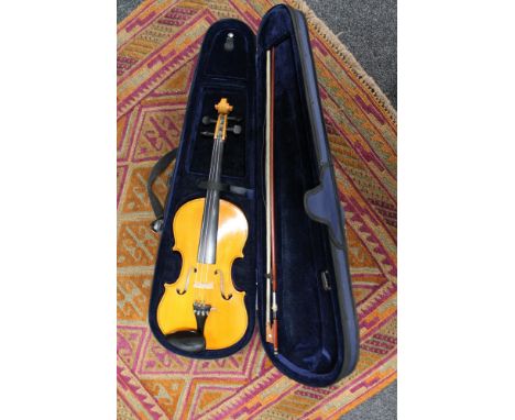 A violin and bow in case 