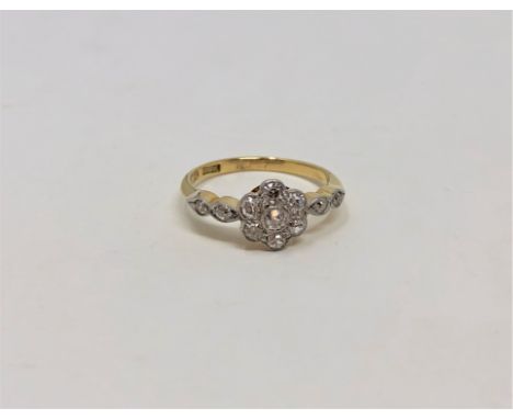 An 18ct gold diamond floral cluster ring, size J/K CONDITION REPORT: 2.2g