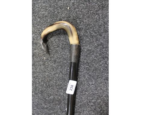 A white metal mounted horn walking stick 