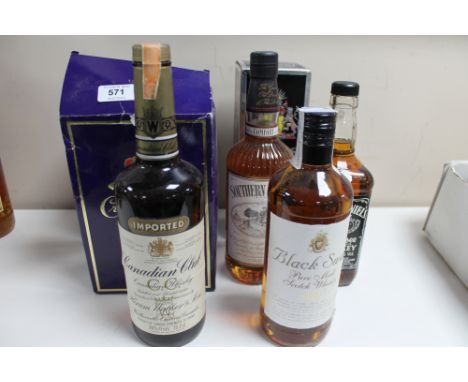 Seven bottles of alcohol - Canadian Club Whisky, Southern comfort, black swan scotch, Crown Royal Whisky, Bells 12 year old b