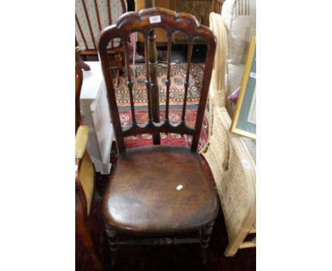 An antique chair together with standard lamp 