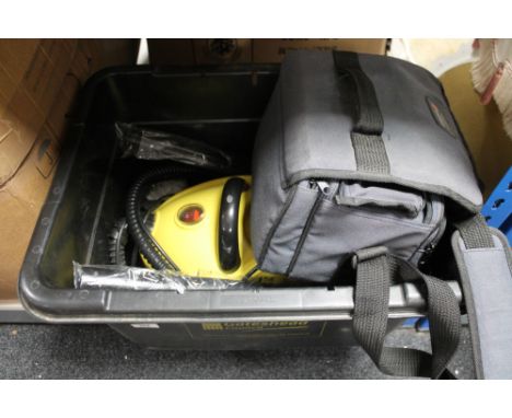 A box of steam cleaner and an Orion video camera 
