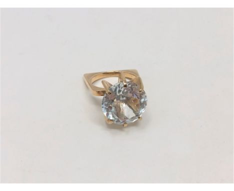 A gold ring set with a large pale blue stone, size K CONDITION REPORT: 6.9g