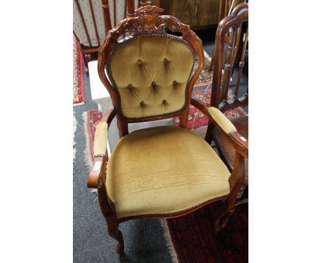 A reproduction button backed armchair 
