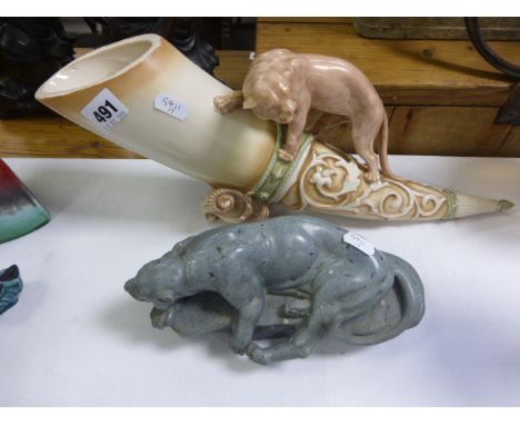 Carved Model of a Big Cat lying on a rock together with a Dux Style Ceramic Horn with Large Cat (a/f)