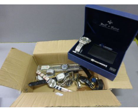 Quantity of Wristwatches to include Vostok, Swatch and a plus a Bell & Rose Watch and Writing Set