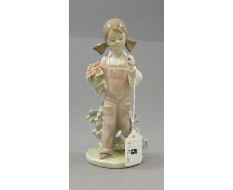 Lladro Figure of a Girl with a Bird and holding Flowers