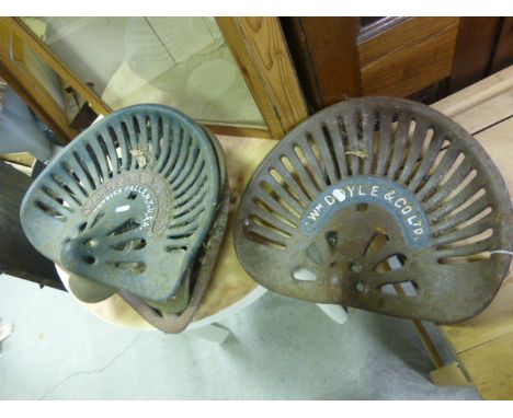 Four Vintage Cast Iron Tractor Seats