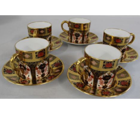 Five Royal Crown Derby "Imari" 1128 coffee cans and saucers