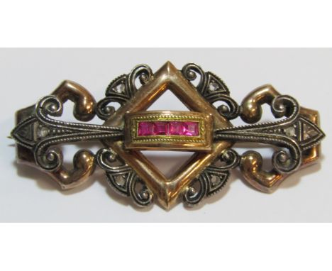 Victorian diamond and ruby brooch with filigree design, tested as 9ct old - total weight 5g