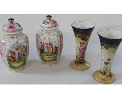 Pair of Dresden style porcelain lidded vases with transfer printed decoration and blue printed cross hatch mark to base &amp;