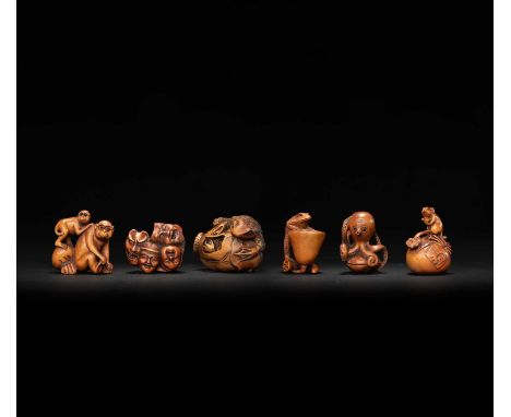 FIVE WOOD NETSUKE AND AN OKIMONO20TH CENTURYMost carved as animals interacting with various objects; one a netsuke depicting 