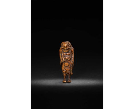 A LARGE JAPANESE NETSUKE OF AN ONI NEMBUTSUEDO PERIOD, 18TH/19TH CENTURYBoldly carved with the eyes inlaid in horn; the feroc