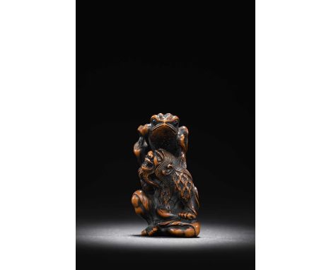 A JAPANESE BOXWOOD NETSUKE OF GAMA SENNIN BY NAITO TOYOMASA (1773-1856)EDO PERIOD, 18TH/19TH CENTURYFinely carved and stained