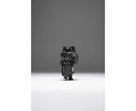 A GOOD JAPANESE DARK WOOD NETSUKE OF SHOKI AND THREE ONIMEIJI ERA, 19TH CENTURYThe demon-queller is depicted standing, holdin
