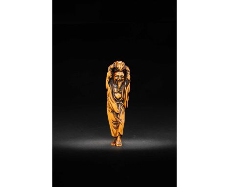 A TALL WOOD NETSUKE OF GAMA SENNINMEIJI ERA, 19TH CENTURYThe Immortal depicted standing, happily smiling whilst lifting his l