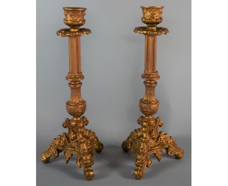A Pair of Gold Sprayed Metal Candle Sticks on Tripod Bases, 28cm High 
