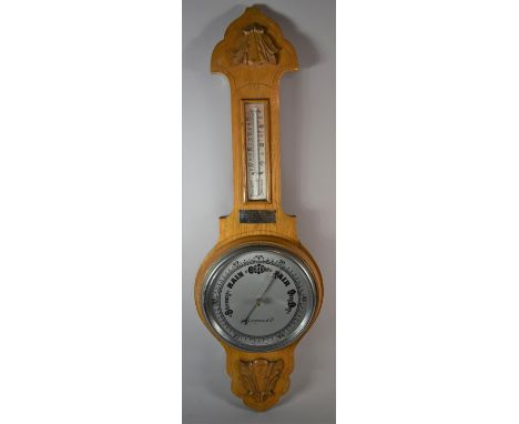 A Mid 20th Century Light Oak Aneroid Wheel Barometer with Temperature Scale 