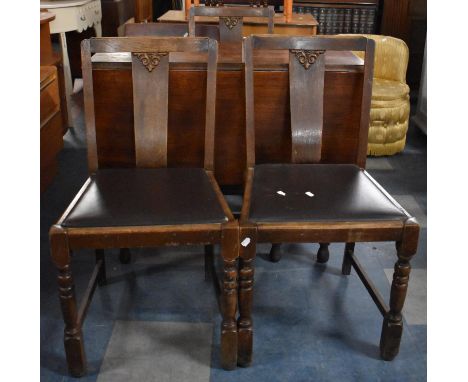 An Oak Drop Leaf Gate Leg Table with Three Dining Chairs 