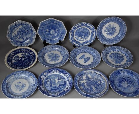 A Collection of Various Spode Blue and White Plates to Include Patterns Such as Decorating the Tree, Botanical, Snowball Game